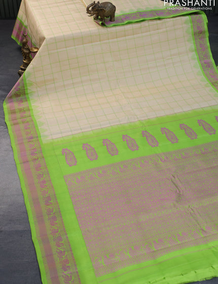 Pure gadwal silk saree cream and light green with allover checked pattern and thread woven border