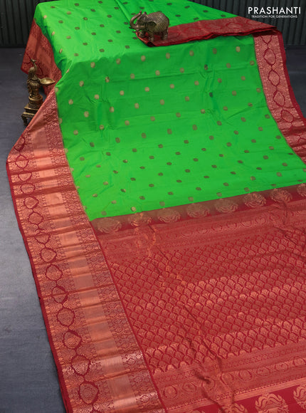 Semi gadwal saree light green and maroon with copper zari woven buttas and temple design long zari woven border