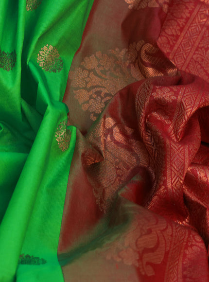 Semi gadwal saree light green and maroon with copper zari woven buttas and temple design long zari woven border