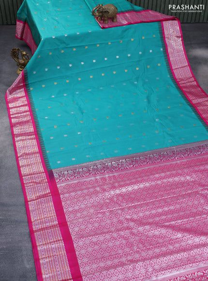 Semi gadwal saree teal green and pink with silver & gold zari woven buttas and temple design zari woven border