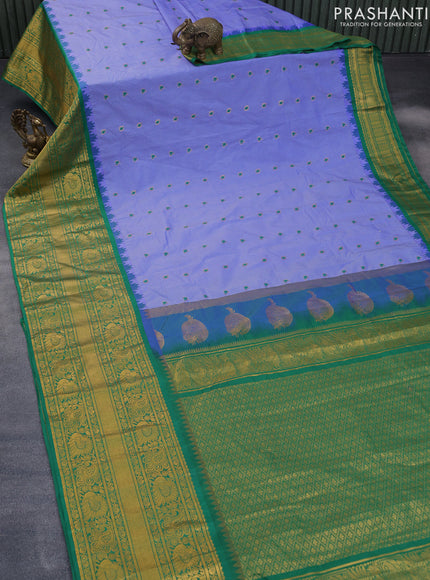 Semi gadwal saree blue and green with allover stripes pattern and temple design long zari woven border