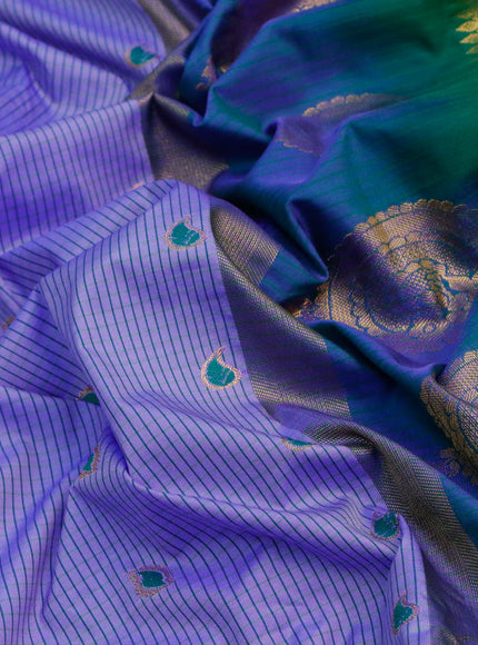 Semi gadwal saree blue and green with allover stripes pattern and temple design long zari woven border