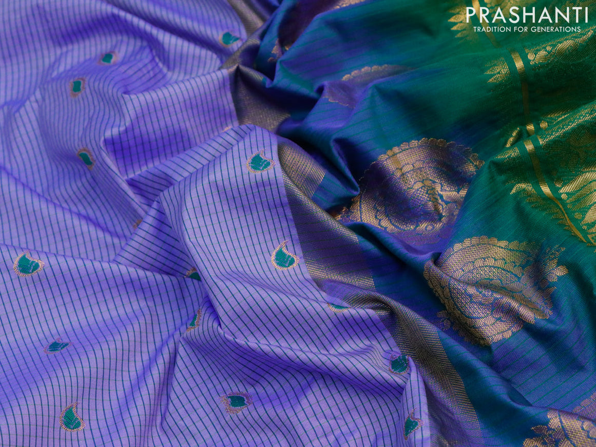 Semi gadwal saree blue and green with allover stripes pattern and temple design long zari woven border