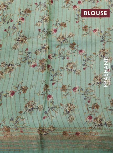 Pure tussar silk saree pastel green with allover floral prints and zari woven border