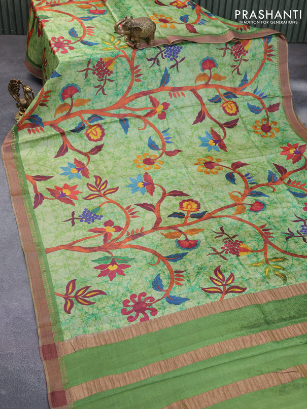 Pure tussar silk saree green shade with allover floral prints and zari woven border