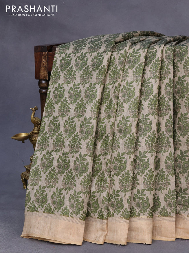 Pure tussar silk saree grey shade and sap green with allover floral prints and zari woven border