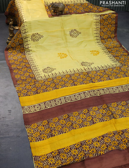 Bishnupuri silk saree yellow and brown with butta prints and printed border