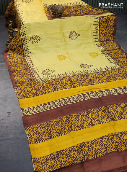 Bishnupuri silk saree yellow and brown with butta prints and printed border