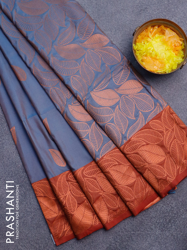 Semi soft silk saree dual shade of blue and rust shade with copper zari woven leaf buttas and copper zari woven border