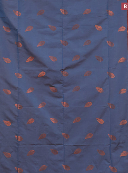 Semi soft silk saree dual shade of blue and rust shade with copper zari woven leaf buttas and copper zari woven border