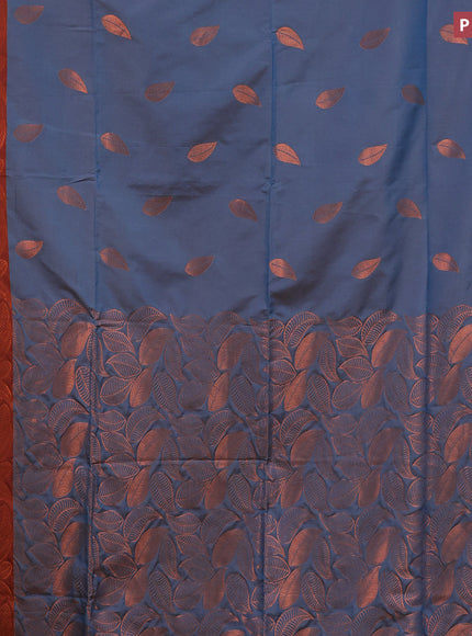 Semi soft silk saree dual shade of blue and rust shade with copper zari woven leaf buttas and copper zari woven border