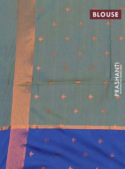 Semi soft silk saree dual shade of bluish green and blue with allover self emboss & zari weaves and copper zari woven butta border