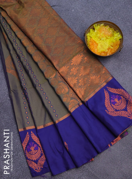 Semi soft silk saree dual shade of bluish green and blue with allover self emboss & zari weaves and copper zari woven butta border