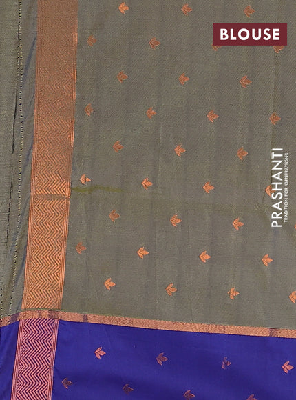 Semi soft silk saree dual shade of bluish green and blue with allover self emboss & zari weaves and copper zari woven butta border