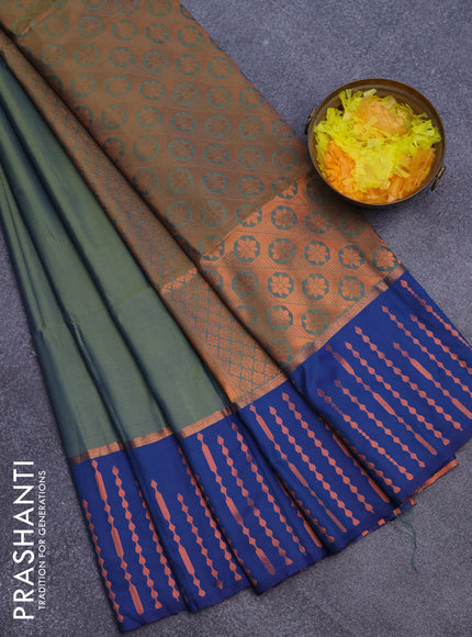 Semi soft silk saree dual shade of green and blue with box type zari buttas and copper zari woven bordder