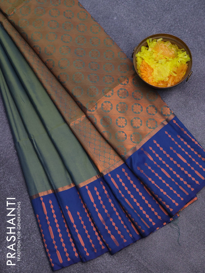 Semi soft silk saree dual shade of green and blue with box type zari buttas and copper zari woven bordder