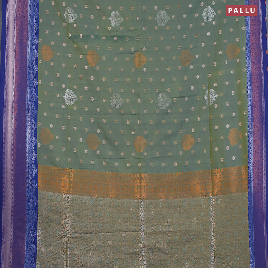 Semi soft silk saree dual shade of green and blue with allover zari woven buttas and zari woven border