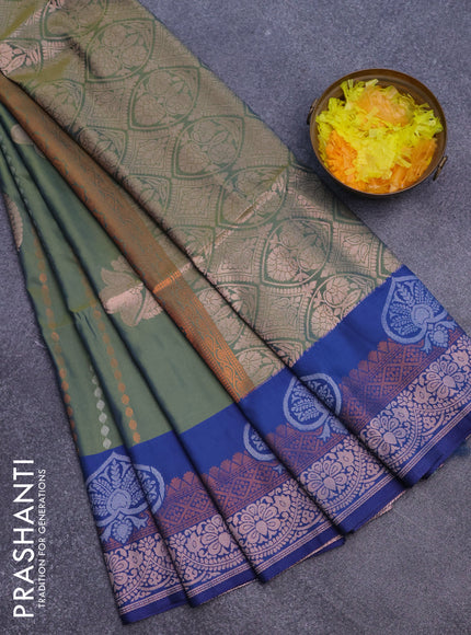 Semi soft silk saree dual shade of greeb and blue with allover zari weaves & buttas and zari woven border