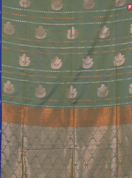 Semi soft silk saree dual shade of greeb and blue with allover zari weaves & buttas and zari woven border