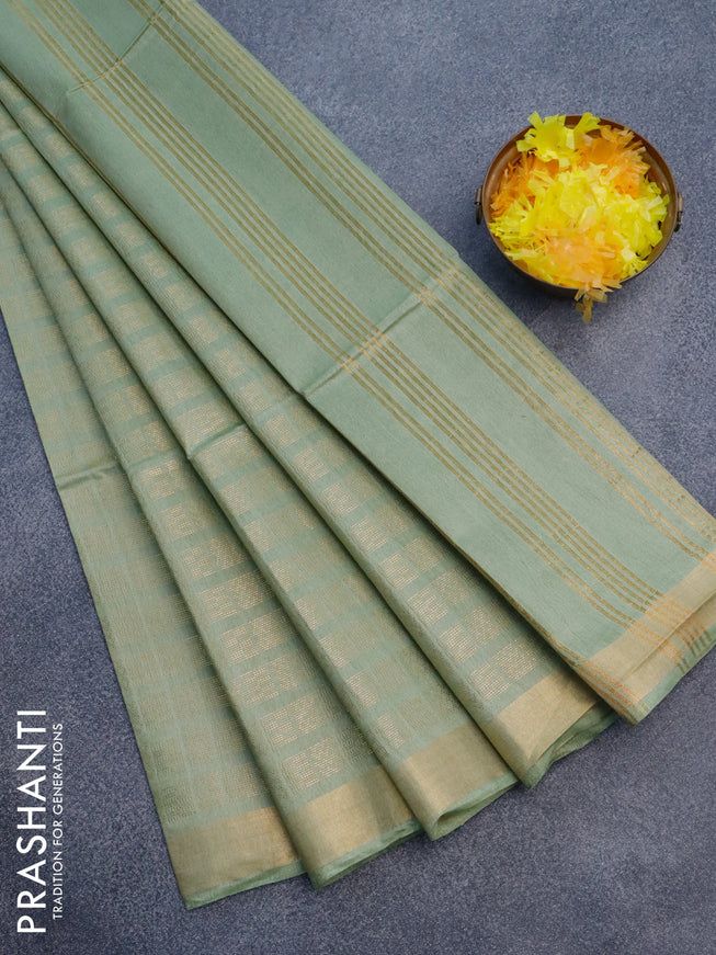 Munga jacquard saree pastel green with allover geometric zari weaves and zari woven border