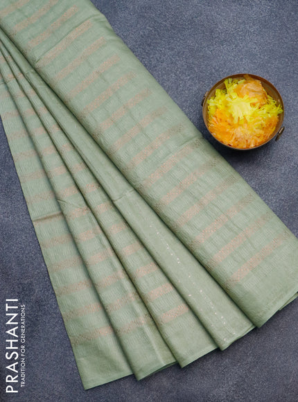 Munga jacquard saree pastel green with allover copper zari weaves and sequin work pallu