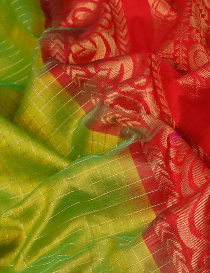 Kuppadam silk cotton saree dual shade of light green and red with allover zari checked pattern and temple design long zari woven butta border