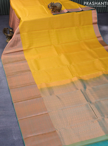 Pure kanchipuram silk saree mustard yellow and dual shade of teal blue with allover copper zari woven butta weaves and long copper zari woven border