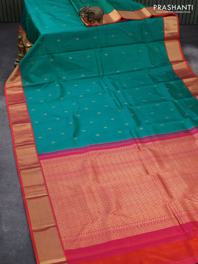 Pure kanchipuram silk saree teal shade and dual shade of orange with zari woven buttas and zari woven korvai border