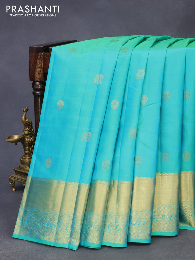 Pure kanchipuram silk saree dual shade of teal green and pink with zari woven buttas and zari woven border