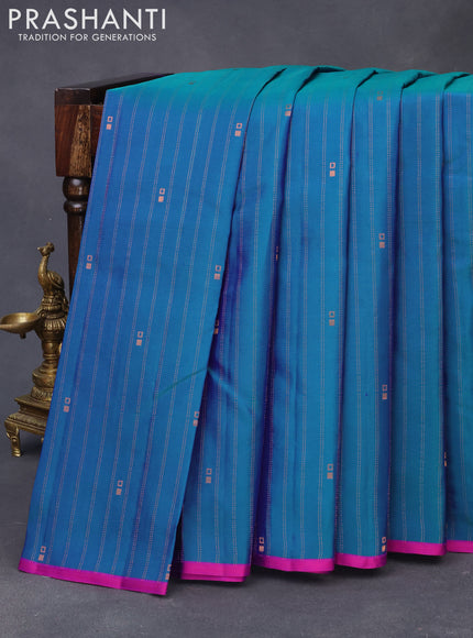 Pure kanchipuram silk saree dual shade of teal bluish green and pink with allover copper zari weaves & buttas and thread woven piping border