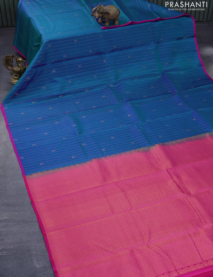 Pure kanchipuram silk saree dual shade of teal bluish green and pink with allover copper zari weaves & buttas and thread woven piping border