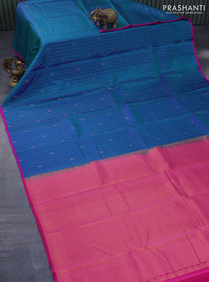 Pure kanchipuram silk saree dual shade of teal bluish green and pink with allover copper zari weaves & buttas and thread woven piping border