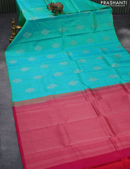 Pure kanchipuram silk saree dual shade of teal bluish green and dark pink with silver zari woven buttas in borderless style