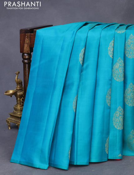 Pure kanchipuram silk saree teal green and pink with zari woven buttas in borderless style