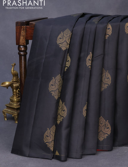 Pure kanchipuram silk saree black and dual shade of pinkish orange with zari woven buttas in borderless style