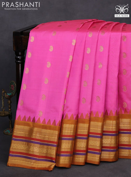 Pure gadwal silk saree light pink and mustard yellow with zari woven buttas and temple design zari woven border