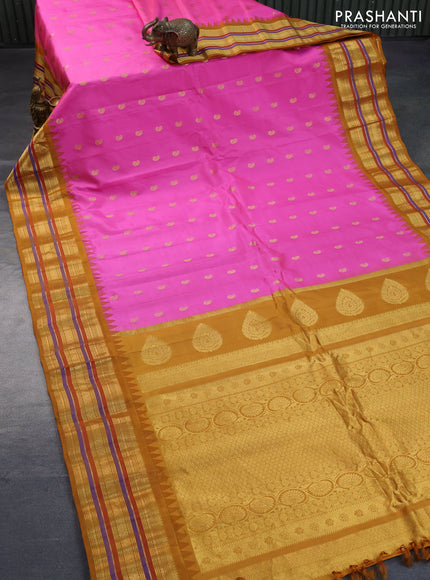 Pure gadwal silk saree light pink and mustard yellow with zari woven buttas and temple design zari woven border