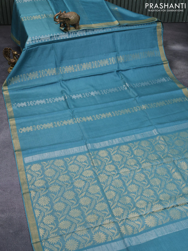 Banana silk saree teal blue with allover zari weaves and zari woven border