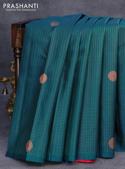 Pure kanjivaram silk saree dual shade of teal bluish green and pink with allover small zari checks & buttas in borderless style