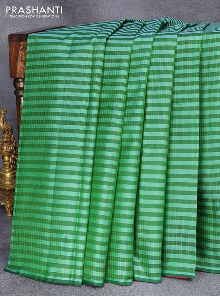 Pure kanjivaram silk saree green and pink with allover stripes & zari weaves in borderless style