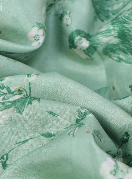 Tussar silk saree pastel green and cream with allover zari buttas and floral design cross stitched embroidery border