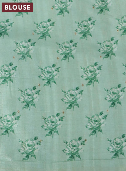 Tussar silk saree pastel green and cream with allover zari buttas and floral design cross stitched embroidery border