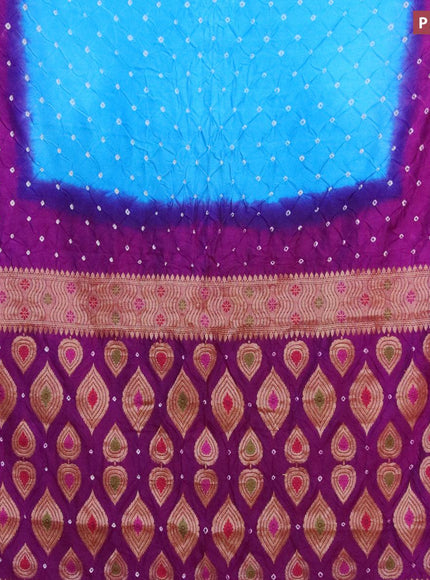 Bandhani saree cs blue and purple with allover bandhani prints and banarasi style border