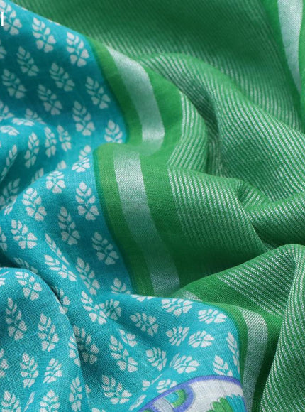 Pure linen saree teal blue and light green with allover butta prints and silver zari woven piping border