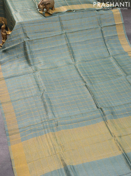 Pure tussar silk saree greyish green and teal blue with allover zari checked pattern and zari woven border and Kalamkari printed blouse