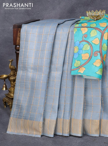 Pure tussar silk saree pastel grey and teal blue with allover zari checked pattern and zari woven border and Kalamkari printed blouse