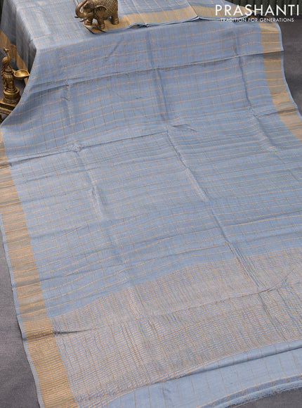 Pure tussar silk saree pastel grey and teal blue with allover zari checked pattern and zari woven border and Kalamkari printed blouse