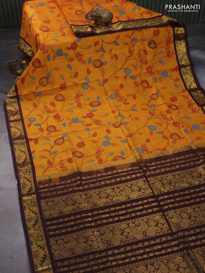 Silk cotton saree mustard yellow and coffee brown with allover kalamkari prints and zari woven korvai border