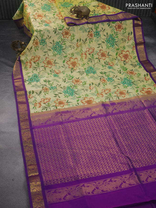 Silk cotton saree pale yellow and violet with allover kalamkari prints and rich zari woven korvai border