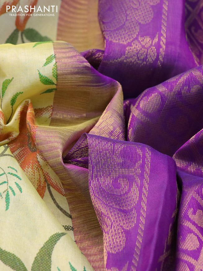 Silk cotton saree pale yellow and violet with allover kalamkari prints and rich zari woven korvai border